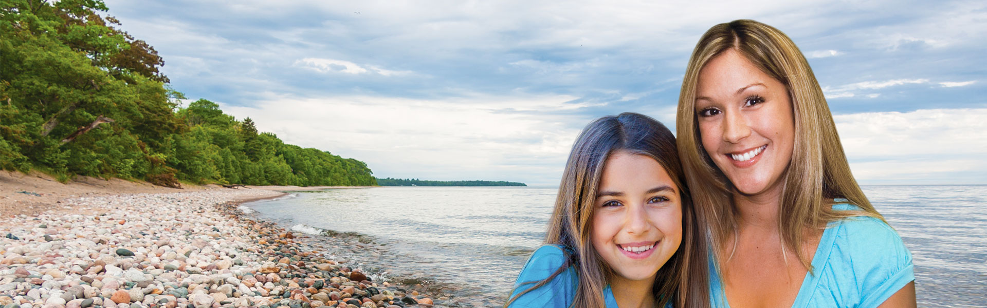mother and daughter by lake